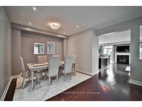 64 Andretti Cres, Brampton, ON - Indoor Photo Showing Dining Room With Fireplace