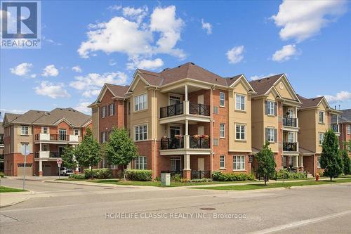 301 - 2339 Sawgrass Drive, Oakville, ON - Outdoor With Balcony With Facade