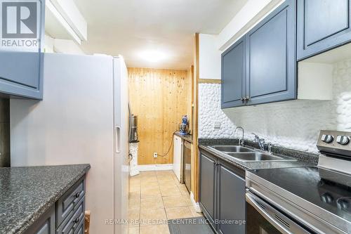 124 - 2095 Roche Court, Mississauga (Sheridan), ON - Indoor Photo Showing Kitchen With Double Sink With Upgraded Kitchen