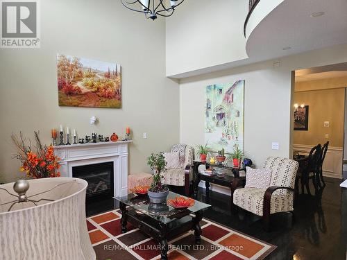 63 Buxton Lane, Clarington (Bowmanville), ON - Indoor Photo Showing Living Room With Fireplace