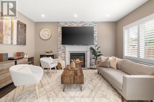 52 Claxton Crescent, Kawartha Lakes, ON - Indoor Photo Showing Living Room With Fireplace