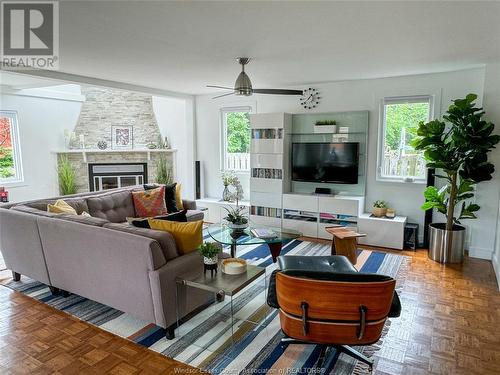 8235 Riverside Drive East, Windsor, ON - Indoor Photo Showing Living Room With Fireplace