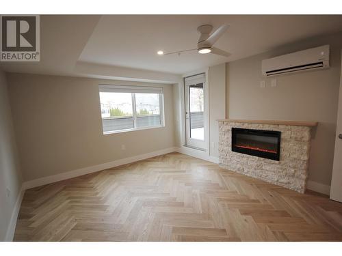 217 Elm Avenue Unit# 109, Penticton, BC - Indoor Photo Showing Living Room With Fireplace