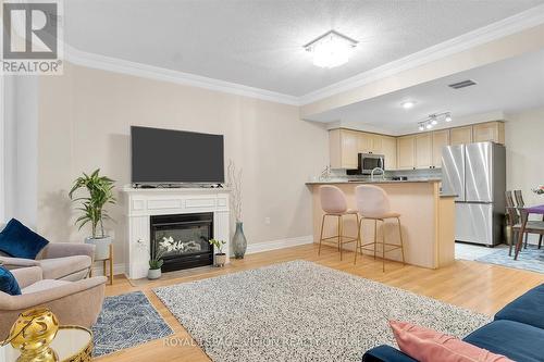 114 - 760 Lawrence Avenue W, Toronto, ON - Indoor Photo Showing Living Room With Fireplace