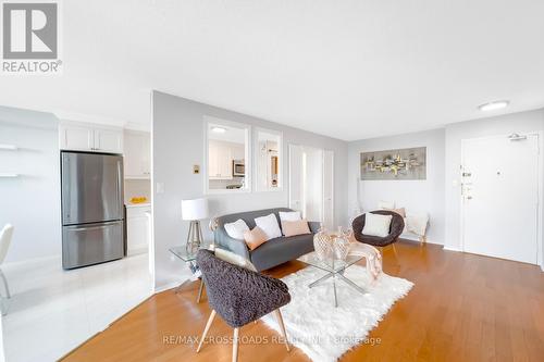 Ph104 - 90 Ling Road, Toronto, ON - Indoor Photo Showing Living Room