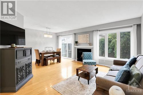 24 Meadowbreeze Drive, Ottawa, ON - Indoor Photo Showing Living Room With Fireplace