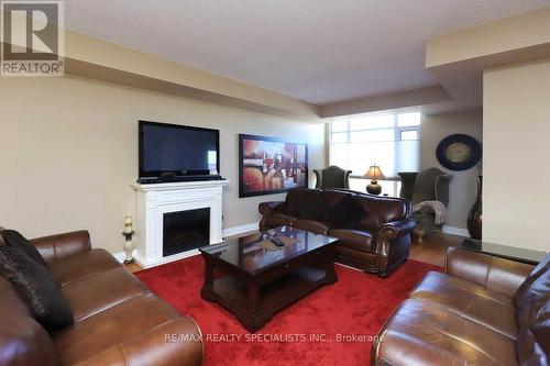 508 - 80 Port Street E, Mississauga, ON - Indoor Photo Showing Living Room With Fireplace
