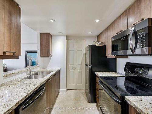 411-1001 Cedarglen Gate, Mississauga, ON - Indoor Photo Showing Kitchen With Stainless Steel Kitchen With Double Sink With Upgraded Kitchen