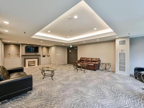 411-1001 Cedarglen Gate, Mississauga, ON - Indoor With Fireplace