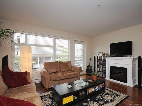 202-1510 Hillside Ave, Victoria, BC - Indoor Photo Showing Living Room With Fireplace