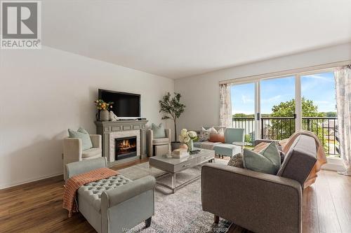 8591 Riverside Unit# 702, Windsor, ON - Indoor Photo Showing Living Room With Fireplace