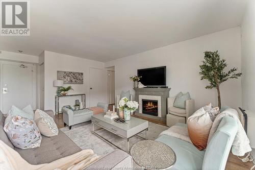 8591 Riverside Unit# 702, Windsor, ON - Indoor Photo Showing Living Room With Fireplace