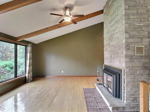 Living room - 109 Rue Alix, Val-D'Or, QC - Indoor With Fireplace