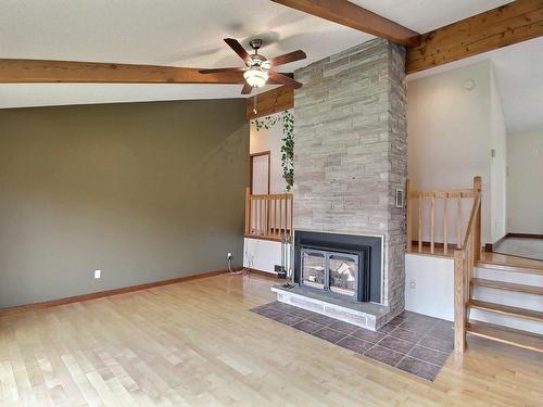 Living room - 109 Rue Alix, Val-D'Or, QC - Indoor With Fireplace