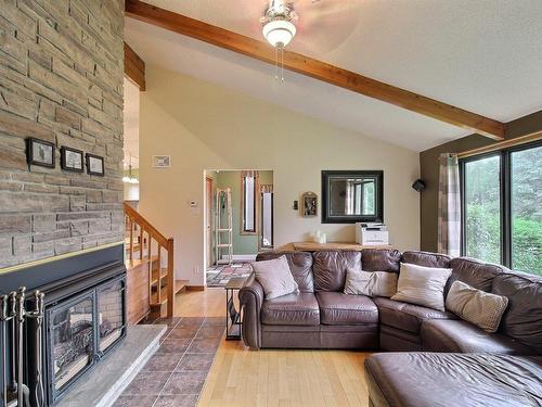 Living room - 109 Rue Alix, Val-D'Or, QC - Indoor Photo Showing Living Room With Fireplace