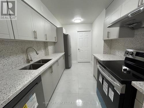 703 - 320 Dixon Road, Toronto, ON - Indoor Photo Showing Kitchen With Double Sink With Upgraded Kitchen