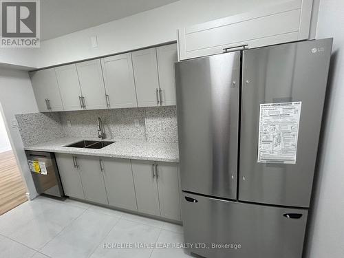 703 - 320 Dixon Road, Toronto, ON - Indoor Photo Showing Kitchen With Double Sink