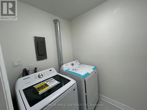 703 - 320 Dixon Road, Toronto W09, ON - Indoor Photo Showing Laundry Room