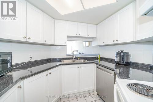 611 - 2550 Lawrence Avenue E, Toronto, ON - Indoor Photo Showing Kitchen With Double Sink