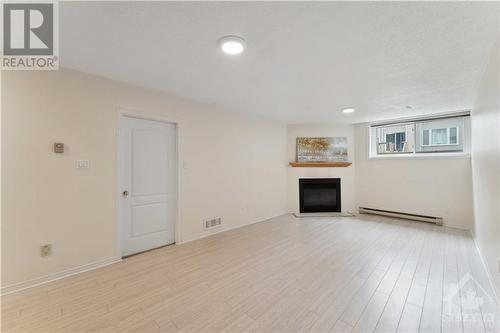 large finished basement - 16 Winterburn Terrace, Ottawa, ON - Indoor With Fireplace