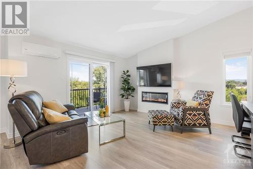 225 Spence Avenue Unit#202, Hawkesbury, ON - Indoor Photo Showing Living Room With Fireplace