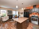 B-751 9Th St, Courtenay, BC  - Indoor Photo Showing Kitchen With Fireplace 