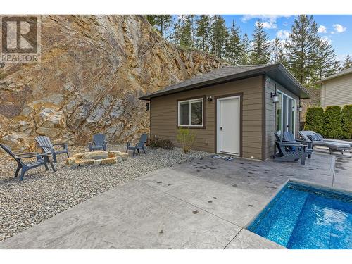 405 Prestwick Street, Kelowna, BC - Outdoor With In Ground Pool With Exterior