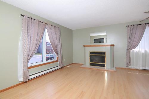 13 Cumming Street, St. Catharines, ON - Indoor Photo Showing Living Room With Fireplace