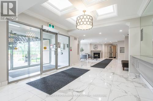 501 - 2085 Amherst Heights Drive, Burlington, ON - Indoor Photo Showing Other Room With Fireplace