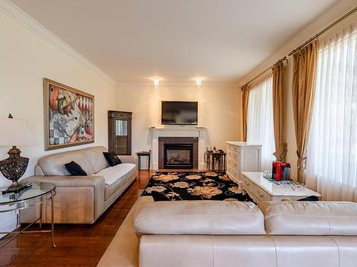 Salle familiale - 3920 Rue De Lisbonne, Brossard, QC - Indoor Photo Showing Living Room With Fireplace