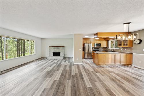 4019 Miller Road, Kelowna, BC - Indoor With Fireplace