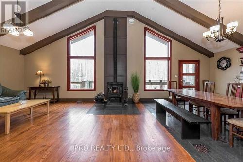 9 Raven Hill Drive, Tiny, ON - Indoor Photo Showing Dining Room With Fireplace