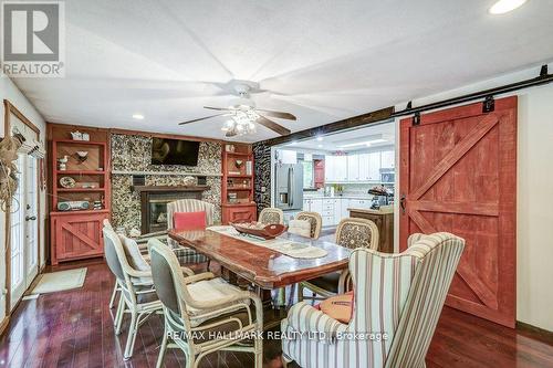 6 Elm Lane, Tiny, ON - Indoor Photo Showing Dining Room With Fireplace