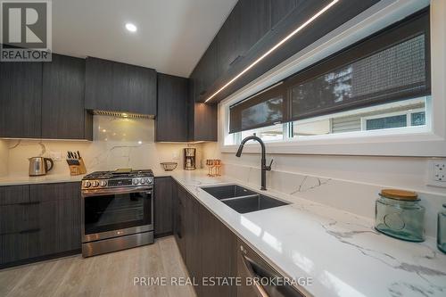 12 Warwick Avenue, Lambton Shores (Grand Bend), ON - Indoor Photo Showing Kitchen With Double Sink With Upgraded Kitchen