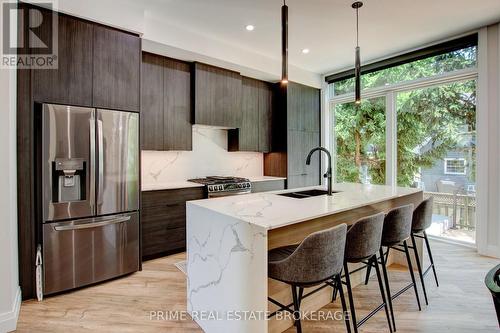 26 Huron Street, Lambton Shores (Grand Bend), ON - Indoor Photo Showing Kitchen With Double Sink With Upgraded Kitchen