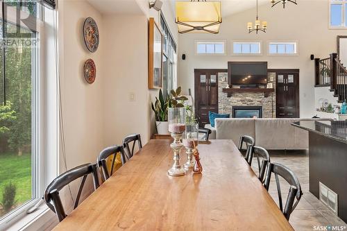 618 Cedar Avenue, Dalmeny, SK - Indoor Photo Showing Dining Room With Fireplace