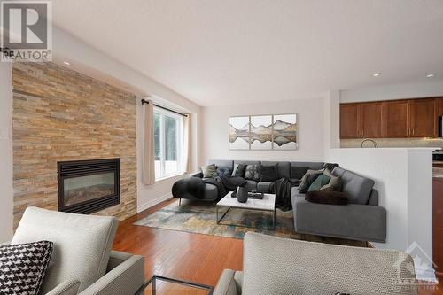 335 Widgeon Way, Ottawa, ON - Indoor Photo Showing Living Room With Fireplace