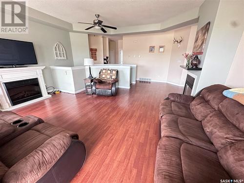 304 Abbott Bay, Estevan, SK - Indoor Photo Showing Living Room With Fireplace