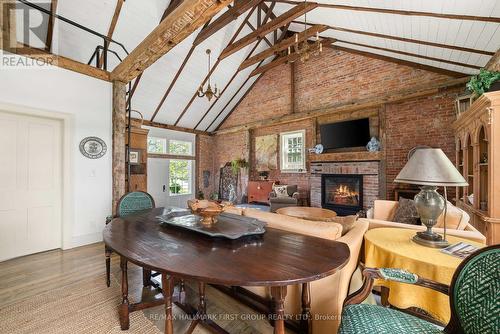 2491 County Rd 64, Prince Edward County (Ameliasburgh), ON - Indoor Photo Showing Dining Room With Fireplace