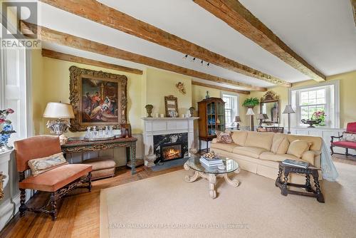 2491 County Rd 64, Prince Edward County (Ameliasburgh), ON - Indoor Photo Showing Living Room With Fireplace