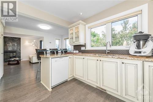 1635 Blohm Drive, Ottawa, ON - Indoor Photo Showing Kitchen With Fireplace With Double Sink