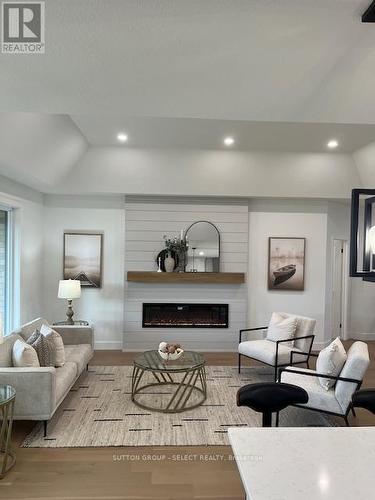 148 Foxborough Place, Thames Centre (Thorndale), ON - Indoor Photo Showing Living Room With Fireplace