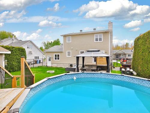 Pool - 2839 Rue Des Jacinthes, Carignan, QC - Outdoor With Above Ground Pool