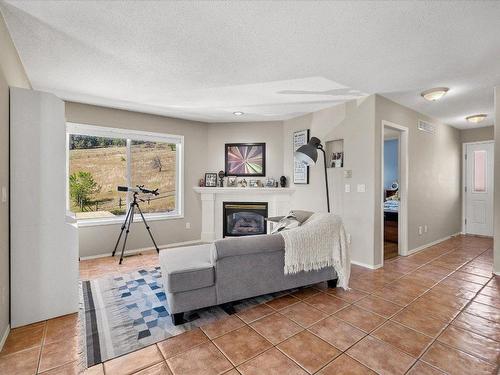 6559 Sherburn Road, Peachland, BC - Indoor With Fireplace