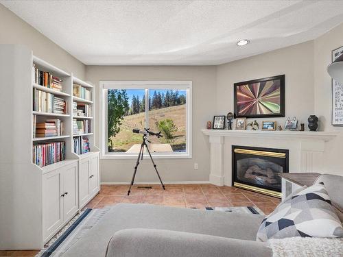 6559 Sherburn Road, Peachland, BC - Indoor With Fireplace