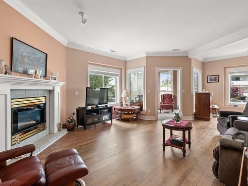 101-1940 Richter Street, Kelowna, BC - Indoor Photo Showing Living Room With Fireplace