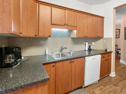 101-1940 Richter Street, Kelowna, BC - Indoor Photo Showing Kitchen With Double Sink