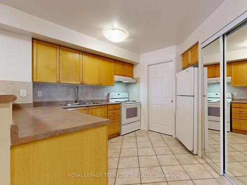 2001-3880 Duke Of York Blvd, Mississauga, ON - Indoor Photo Showing Kitchen With Double Sink