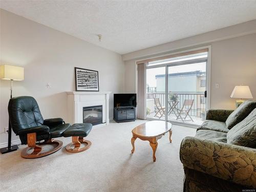 303-2423 Beacon Ave, Sidney, BC - Indoor Photo Showing Living Room With Fireplace