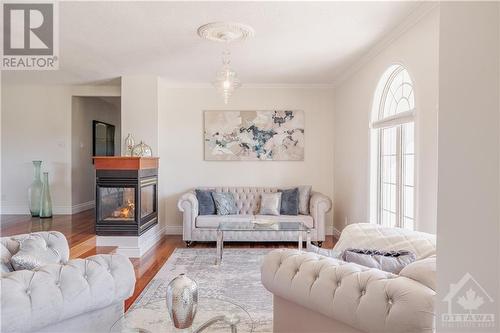 1135 Caprice Court, Ottawa, ON - Indoor Photo Showing Living Room With Fireplace